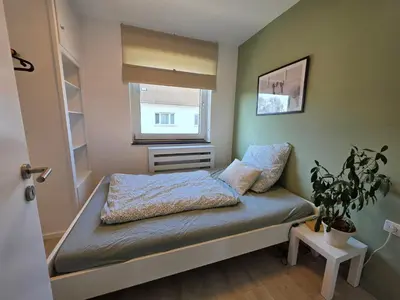 Ein Bett oder Betten in einem Zimmer der Unterkunft Moderne Wohnung mit Balkon in Karlsruhe