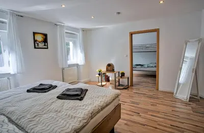 Ein Bett oder Betten in einem Zimmer der Unterkunft FeWo Römerweg