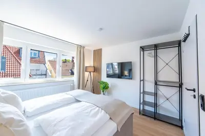 Ein Bett oder Betten in einem Zimmer der Unterkunft Malu Rooms - im Zentrum, Kostenloser Parkplatz, Klima, Balkon, Netflix, 24h Checkin