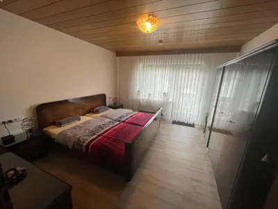 Ein Bett oder Betten in einem Zimmer der Unterkunft Ferienhaus zur Glockenhornquelle