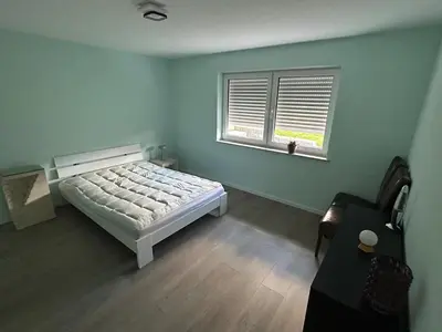 Ein Bett oder Betten in einem Zimmer der Unterkunft Wohnung K voll möbliert