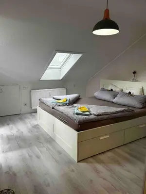 Ein Bett oder Betten in einem Zimmer der Unterkunft Lichtterrasse Sonnige Ruhe im Musikerviertel