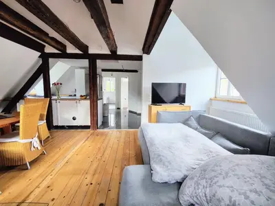 Ein Bett oder Betten in einem Zimmer der Unterkunft Malerisches Apartment am Kirchplatz