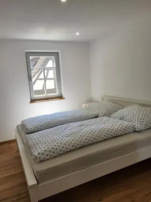 Ein Bett oder Betten in einem Zimmer der Unterkunft Carles Bauernhaus