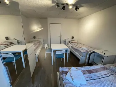 Ein Bett oder Betten in einem Zimmer der Unterkunft Boardinghouse Behrend I