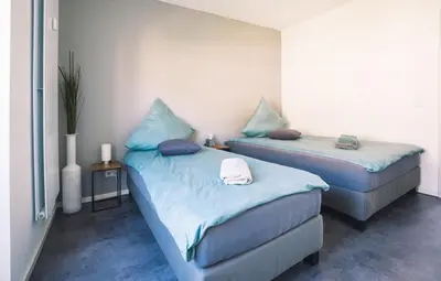 Ein Bett oder Betten in einem Zimmer der Unterkunft Vintage Apartment Schwetzingen - 2 Zimmer - Küche, Bad & Balkon