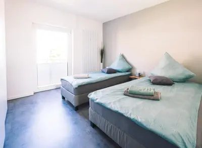 Ein Bett oder Betten in einem Zimmer der Unterkunft Vintage Apartment Schwetzingen - 2 Zimmer - Küche, Bad & Balkon