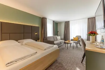 Ein Bett oder Betten in einem Zimmer der Unterkunft Hotel Domizil