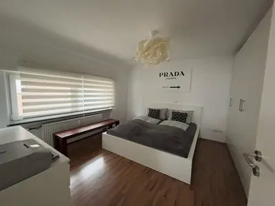 Ein Bett oder Betten in einem Zimmer der Unterkunft Geräumige 90qm zum Wohlfühlen nähe Messe