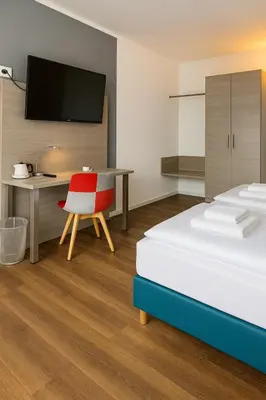 Ein Bett oder Betten in einem Zimmer der Unterkunft AR Boutique Hotel Heusenstamm