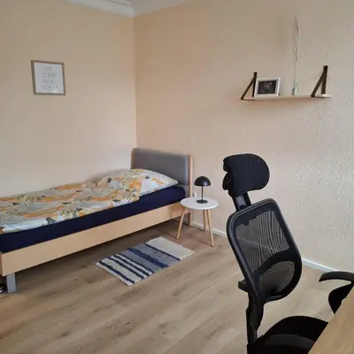 Ein Bett oder Betten in einem Zimmer der Unterkunft Auf der Ried26 - Frisch renoviertes, charmantes Familien-Appartement mit 3 Schlafräumen