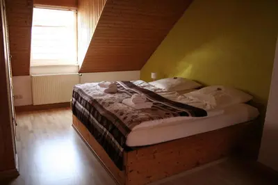 Ein Bett oder Betten in einem Zimmer der Unterkunft Landgasthof Hotel Rebe Alzey