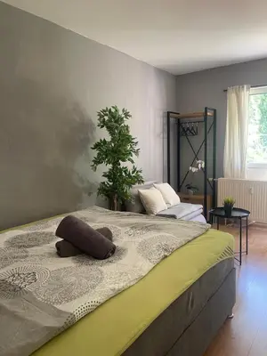 Ein Bett oder Betten in einem Zimmer der Unterkunft Apartment mit Terrasse, 200m Hbf
