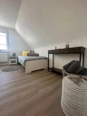Ein Bett oder Betten in einem Zimmer der Unterkunft NeckarNest Ferienwohnung