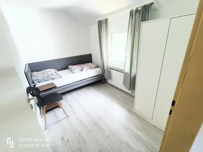 Ein Bett oder Betten in einem Zimmer der Unterkunft Apartment,Haus 21