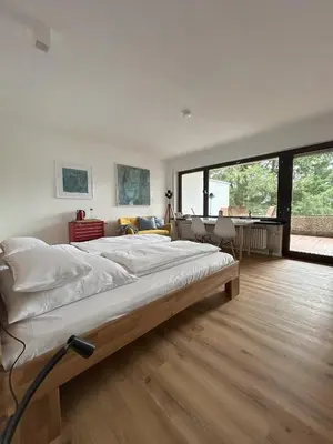 Ein Bett oder Betten in einem Zimmer der Unterkunft Glücks-Quartier Kaffeehof 4