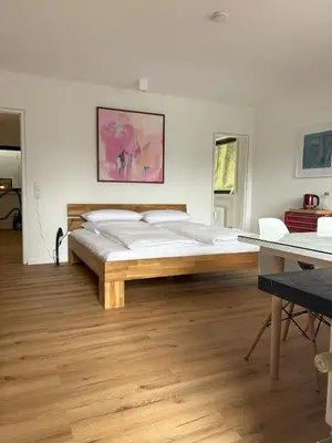 Ein Bett oder Betten in einem Zimmer der Unterkunft Glücks-Quartier Kaffeehof 4