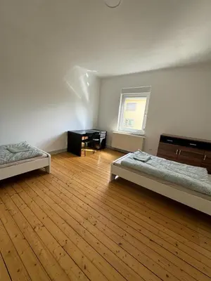Ein Bett oder Betten in einem Zimmer der Unterkunft Monteurwohnung Neustadt Zentrum