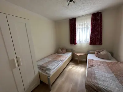 Ein Bett oder Betten in einem Zimmer der Unterkunft Wohnung B2