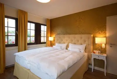 Ein Bett oder Betten in einem Zimmer der Unterkunft Hotel am Kirchplatz