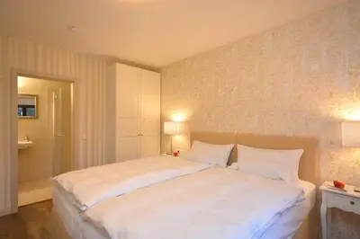 Ein Bett oder Betten in einem Zimmer der Unterkunft Hotel am Kirchplatz