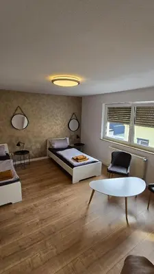 Ein Bett oder Betten in einem Zimmer der Unterkunft Ferienwohnung Regina