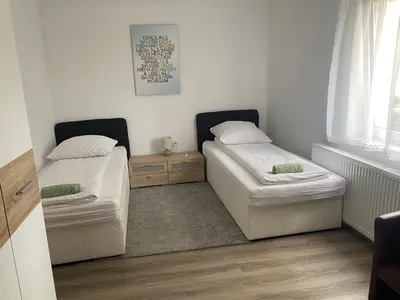 Ein Bett oder Betten in einem Zimmer der Unterkunft Ferienwohnung Venningen
