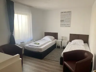 Ein Bett oder Betten in einem Zimmer der Unterkunft Ferienwohnung Venningen