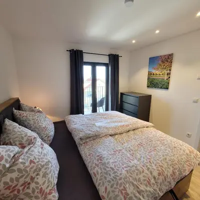 Ein Bett oder Betten in einem Zimmer der Unterkunft VineSinn