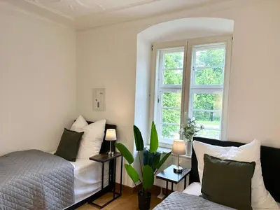 Ein Bett oder Betten in einem Zimmer der Unterkunft BELLA - Family&Business Ap 1, 100m zum Konzerteingang Schloß, Parkplatz, SmartTV, Netflix, Waschmaschine, 24h Checkin, 30qm