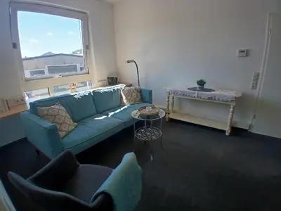 Ein Sitzbereich in der Unterkunft sweet home