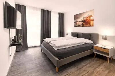 Ein Bett oder Betten in einem Zimmer der Unterkunft LIV Design Apartments Ettlingen-Zentrum