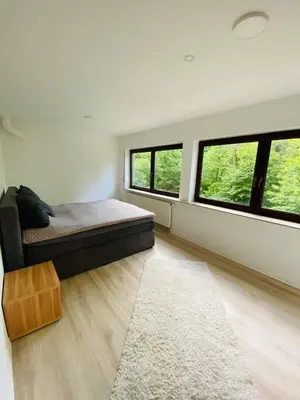 Ein Bett oder Betten in einem Zimmer der Unterkunft Waldzeit XL Apartment Natur und Self Check-in