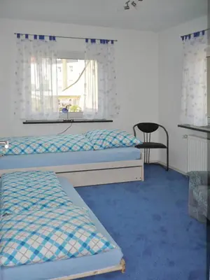 Ein Bett oder Betten in einem Zimmer der Unterkunft Ferienwohnung beim Steinmetzmeister im Quarzwerk