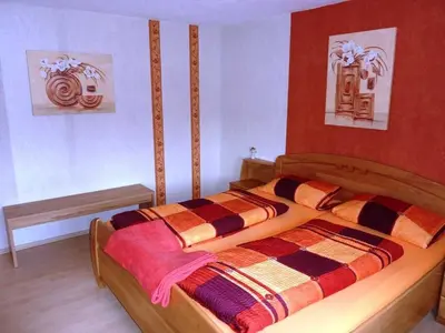 Ein Bett oder Betten in einem Zimmer der Unterkunft Ferienwohnung Kraemer in Erbach