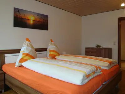 Ein Bett oder Betten in einem Zimmer der Unterkunft Ferienwohnung am Eck