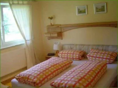 Ein Bett oder Betten in einem Zimmer der Unterkunft Ferienhof Christmann