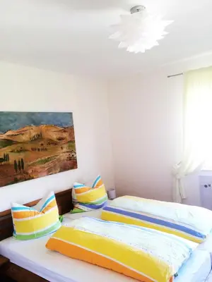 Ein Bett oder Betten in einem Zimmer der Unterkunft Ferienhof Christmann