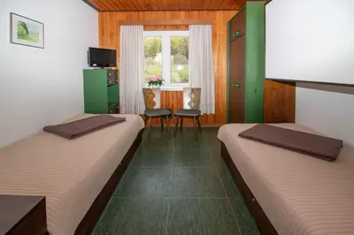 Ein Bett oder Betten in einem Zimmer der Unterkunft Ferienhauser Siefertshof