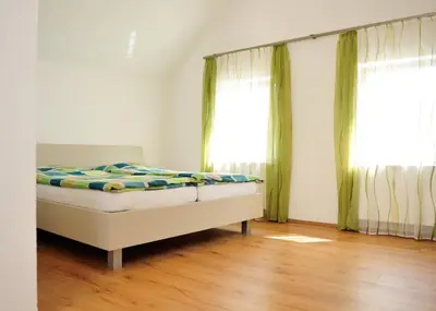 Ein Bett oder Betten in einem Zimmer der Unterkunft Weingut Edling