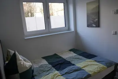 Ein Bett oder Betten in einem Zimmer der Unterkunft Ferienwohnungen Rosengarten
