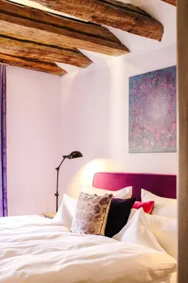 Ein Bett oder Betten in einem Zimmer der Unterkunft Gästehaus im Weingut am Nil