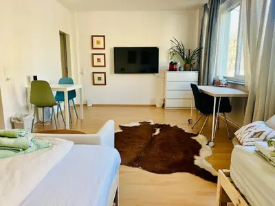 Ein Bett oder Betten in einem Zimmer der Unterkunft UrbanPause Studio KA-Mitte