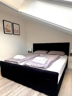 Ein Bett oder Betten in einem Zimmer der Unterkunft Stilvolle Wohnung in Sandhausen