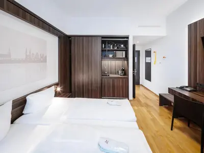 Ein Bett oder Betten in einem Zimmer der Unterkunft sevenDays Hotel BoardingHouse