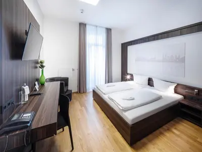 Ein Bett oder Betten in einem Zimmer der Unterkunft sevenDays Hotel BoardingHouse