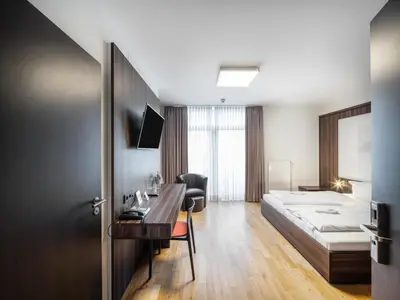 Ein Bett oder Betten in einem Zimmer der Unterkunft sevenDays Hotel BoardingHouse