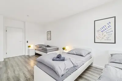 Ein Bett oder Betten in einem Zimmer der Unterkunft MONTEUR - Unterkunft für bis zu 6 Personen in 63128 Dietzenbach - OF03
