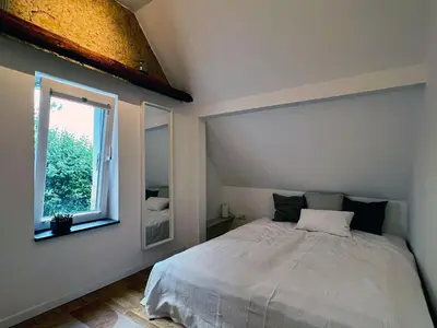 Ein Bett oder Betten in einem Zimmer der Unterkunft Charmantes Häuschen am Waldrand