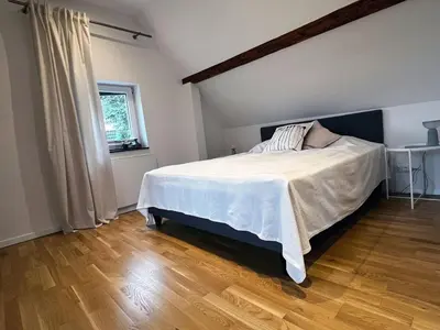 Ein Bett oder Betten in einem Zimmer der Unterkunft Charmantes Häuschen am Waldrand